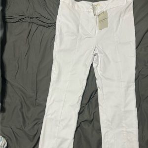 New white slim leg pants with slit on bottom of legs
